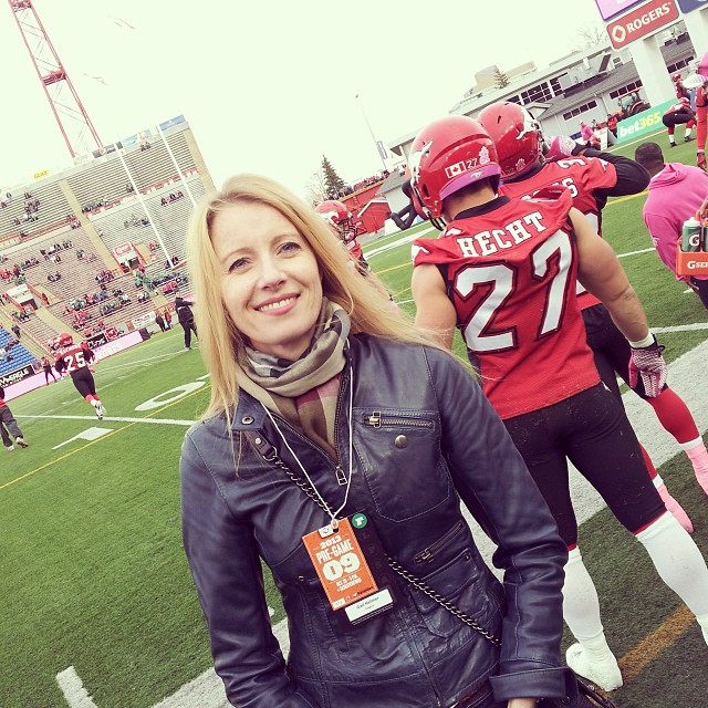 Having fun on the sidelines at a Stampeders game.